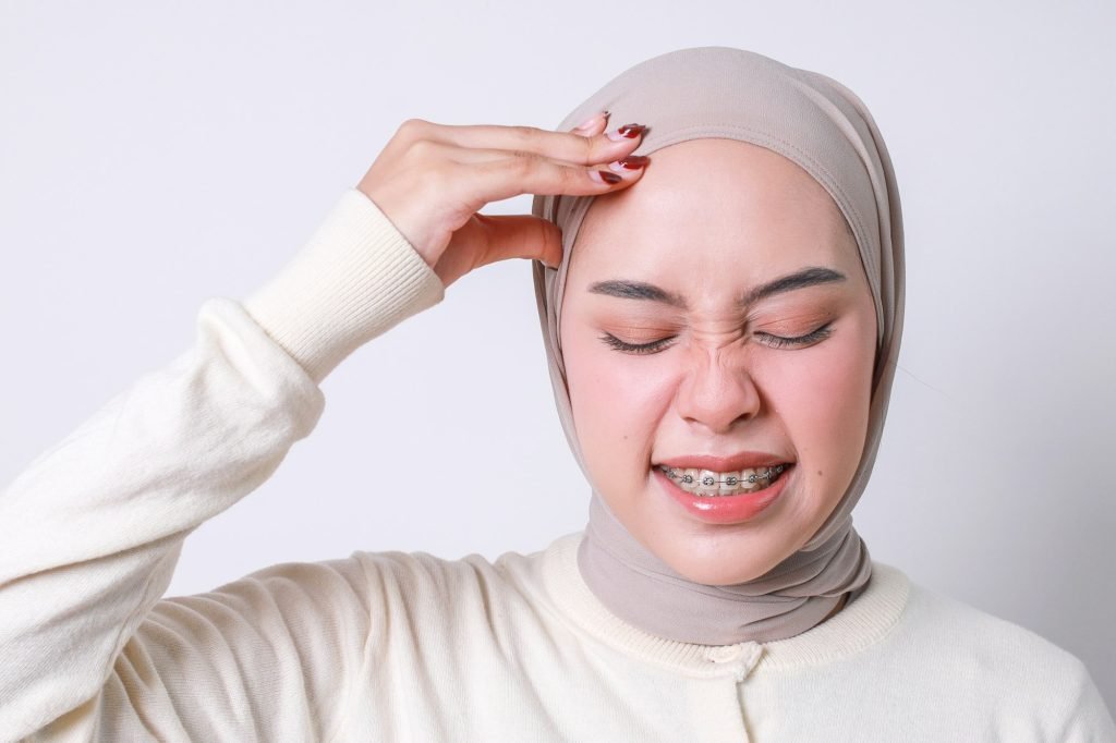 Asian Muslim Woman Suffering Headache