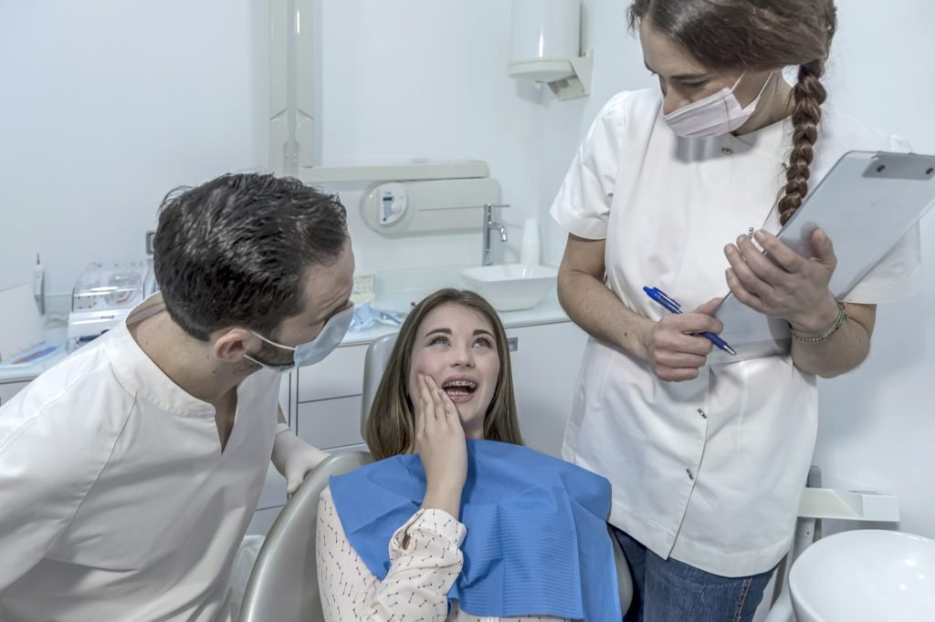 little boy with teeth pain sitting to dental chair. toothache